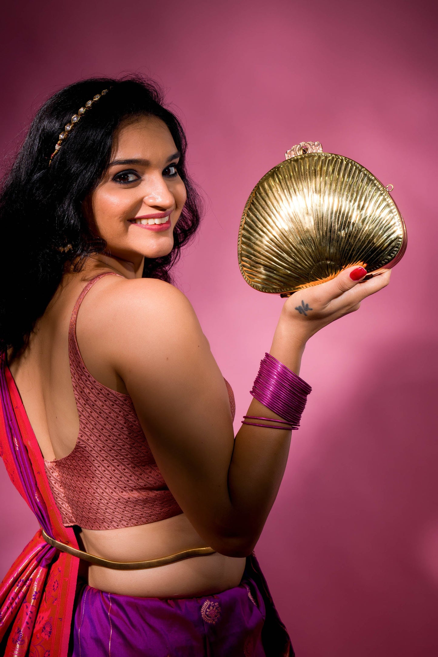 Aafreen Ethnic Shell Shaped Brass Bag