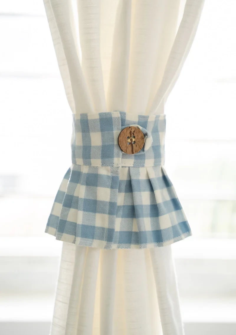 Powderbluegingham100_CottoncurtainpleatedtiebackwithCoconutshellbutton_ffde50a4-649b-44fc-b289-44759922ec5b