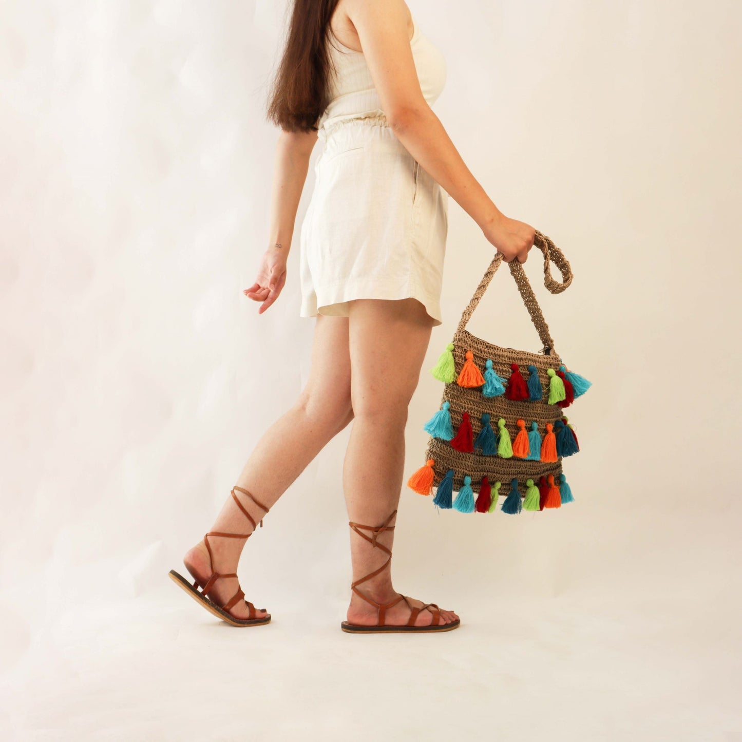 Tasseled crochet Quad-Spirit cross body bag